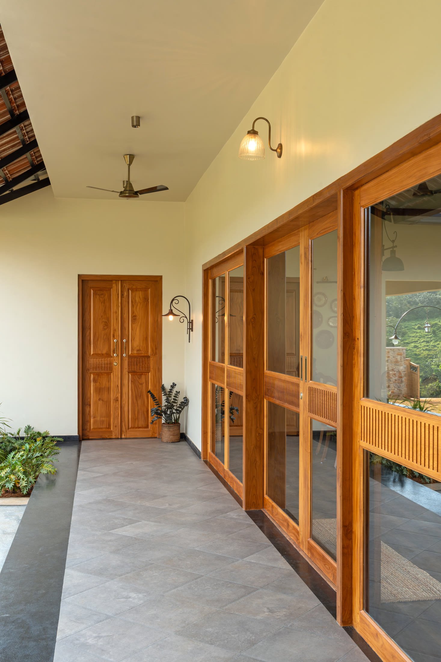 Sheltered timber-lined corridor beside the garden