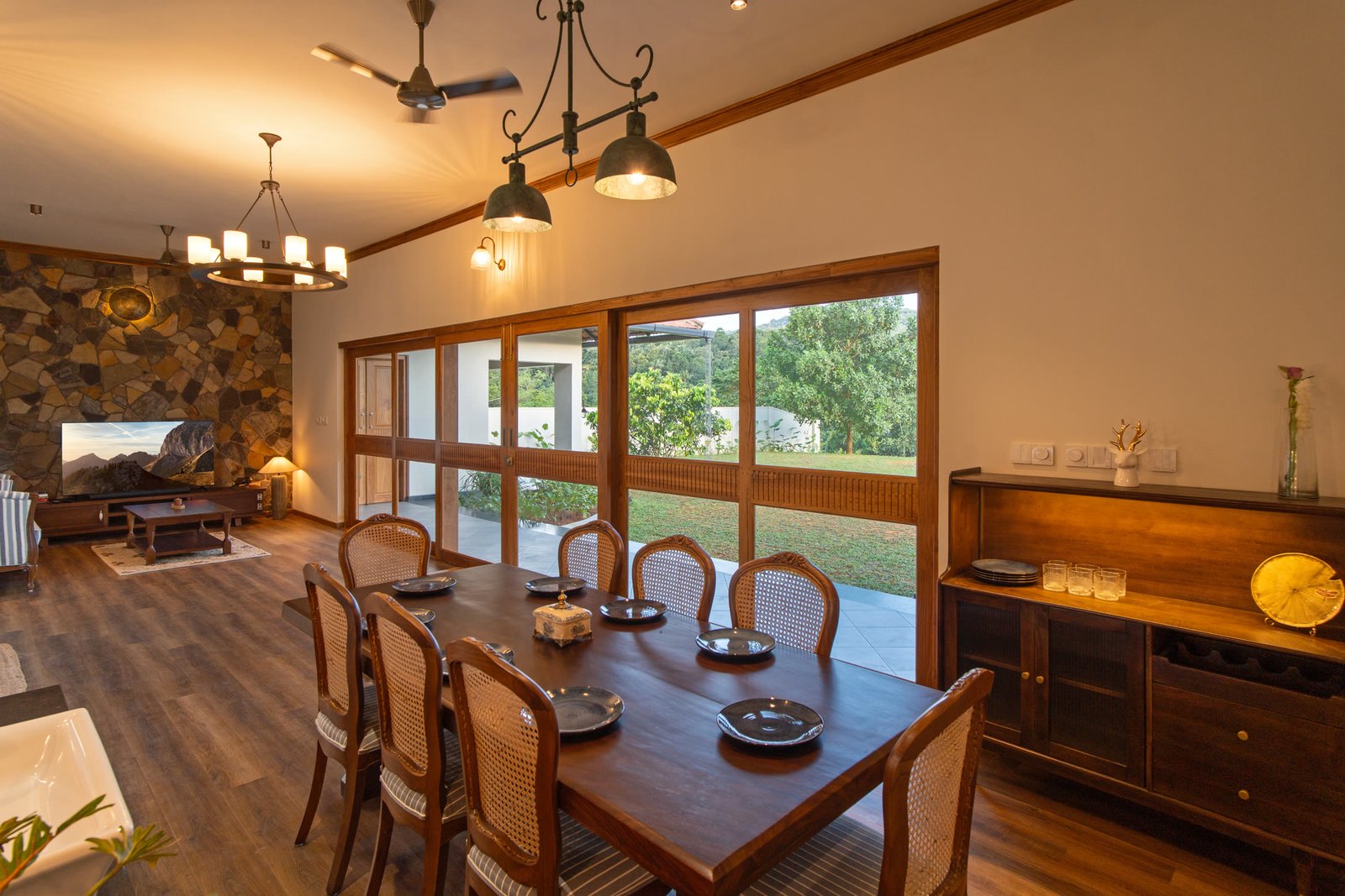 Dining and lounge space with wide garden windows