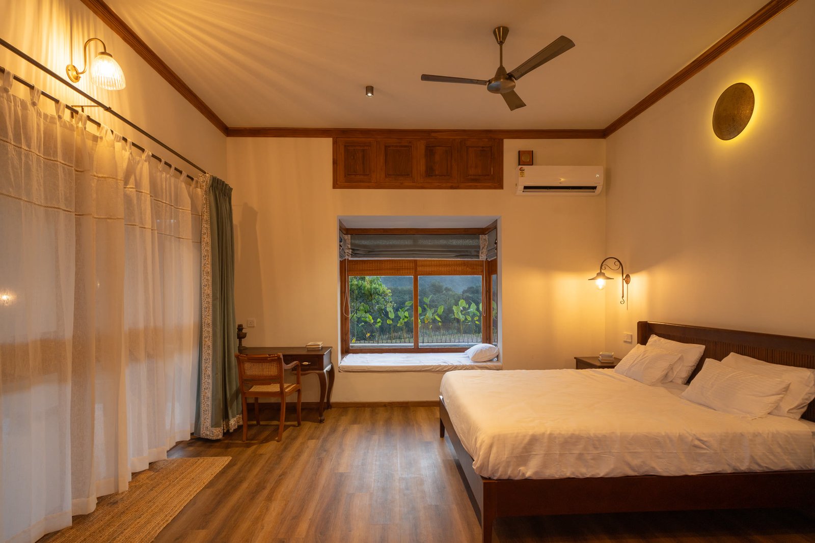 Warm private bedroom with garden window and timber details